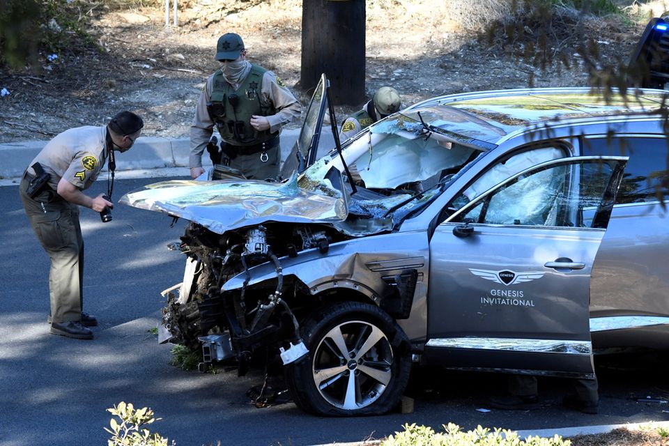 Los Angeles County Sheriff's Deputies inspect the vehicle of golfer Tiger Woods, who was rushed to hospital after suffering multiple injuries, after it was involved in a single-vehicle accident in Los Angeles, California, U.S. February 23, 2021. REUTERS/Gene Blevins TPX IMAGES OF THE DAY