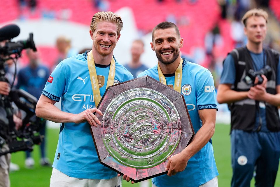 Manchester City's Kevin De Bruyne (left) and Mateo Kovacic celebrate with the trophy after winning the FA Community Shield match against Manchester United at Wembley. Photo: PA