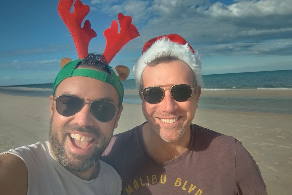 Stephen Milton and his husband Ben making merry on the beach