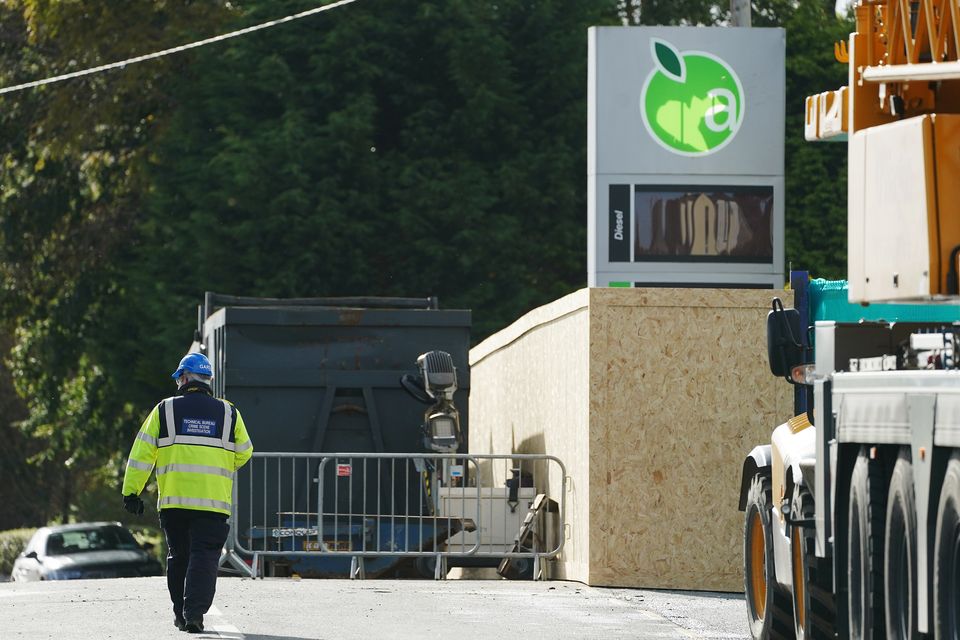 Gardai at the Applegreen service station in the village of Creeslough in Co Donegal (Brian Lawless/PA)