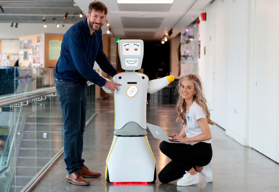 IrelandÕs first socially assistive AI robot 'Stevie II' from robotics engineers at Trinity College Dublin, with Assistant Professor at the School of Engineering Dr. Conor McGinn (left) and researcher Niamh Donnelly, during a special demonstration at the Science Gallery in Dublin.
Brian Lawless/PA Wire