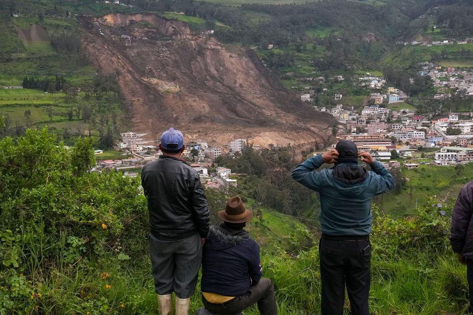 The death toll from a landslide in central Ecuador which buried dozens of homes has been cut to seven. (Dolores Ochoa/AP)