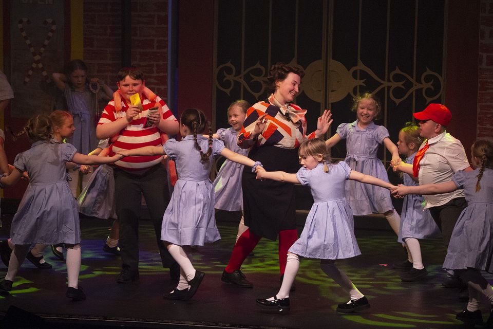 Augustus Gloop (Andy McDermott) and Mrs Gloop (Genevieve Fleming) with dancers in Innovations Theatre School's Charlie and the Chocolate Factory in Gorey Little Theatre.