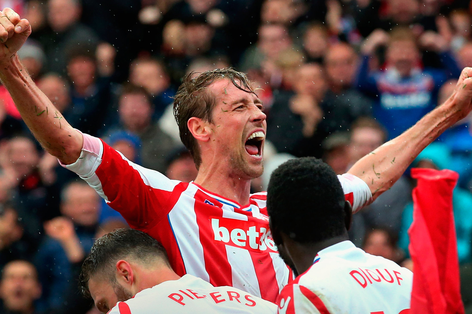 Peter Crouch celebrates scoring his sides second goal with his team mates Erik Pieters and Mame Biram Diouf. Photo: Getty Images