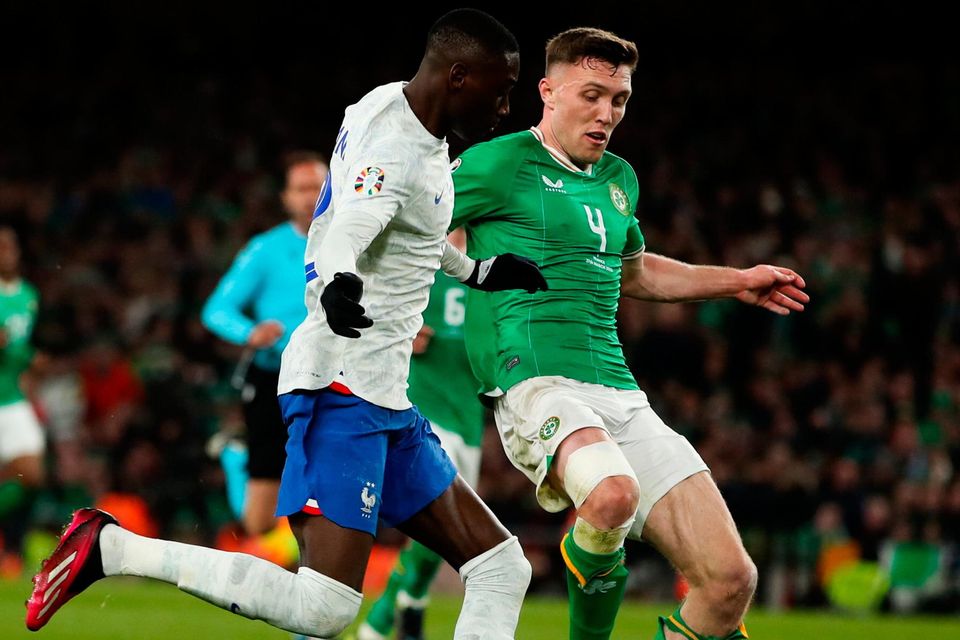 Ireland's Dara O'Shea in action against Randal Kolo Muani of France