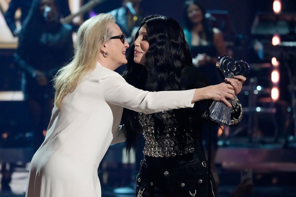 Cher, right, accepts the Icon Award from presenter Meryl Streep during the iHeartRadio Music Awards, Monday, April 1, 2024, at the Dolby Theatre in Los Angeles. (AP Photo/Chris Pizzello)