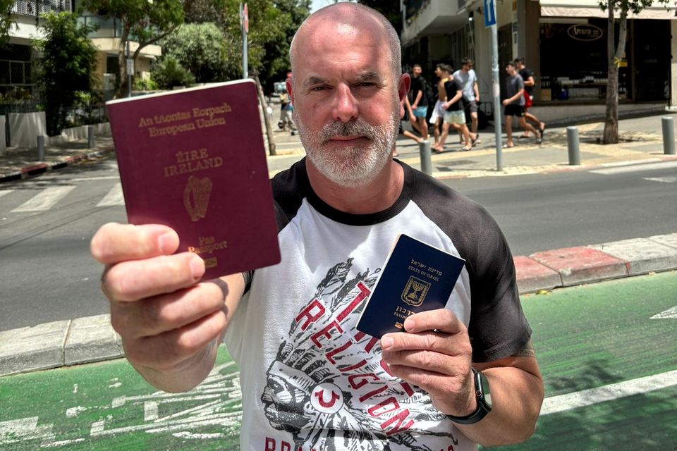 Dual citizen John Costello with his Irish and Israeli passports