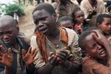 thumbnail: Rwandan refugee children in the Nineties plead with Zairian soldiers to let them cross a bridge to rejoin their mothers who had crossed moments before