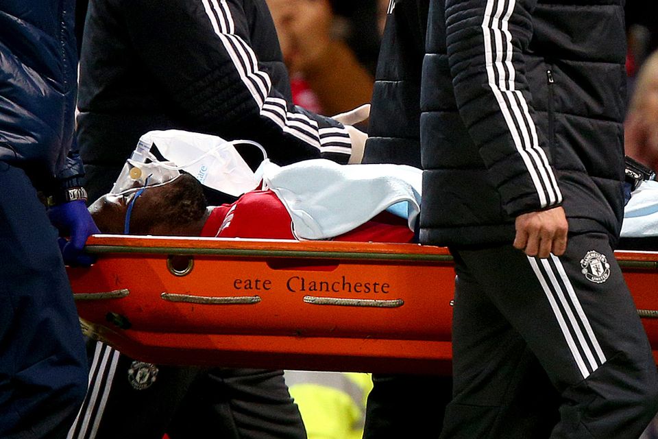 Manchester United's Romelu Lukaku leaves the game on a stretcher