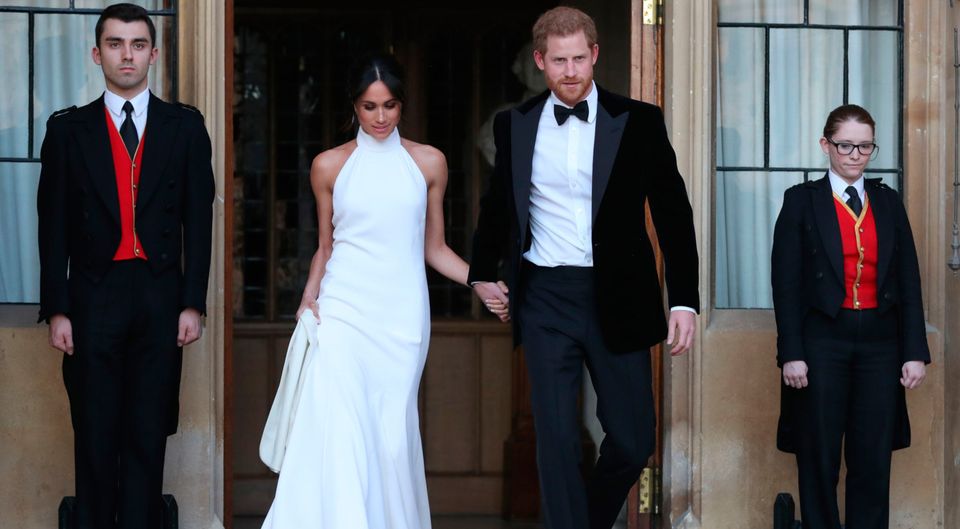 Mr & Mrs: the new Duchess of Sussex Meghan Markle sports a bespoke Stella McCartney halter-neck gown at the after party of her wedding to Prince Harry. Photo: AFP/Getty Images