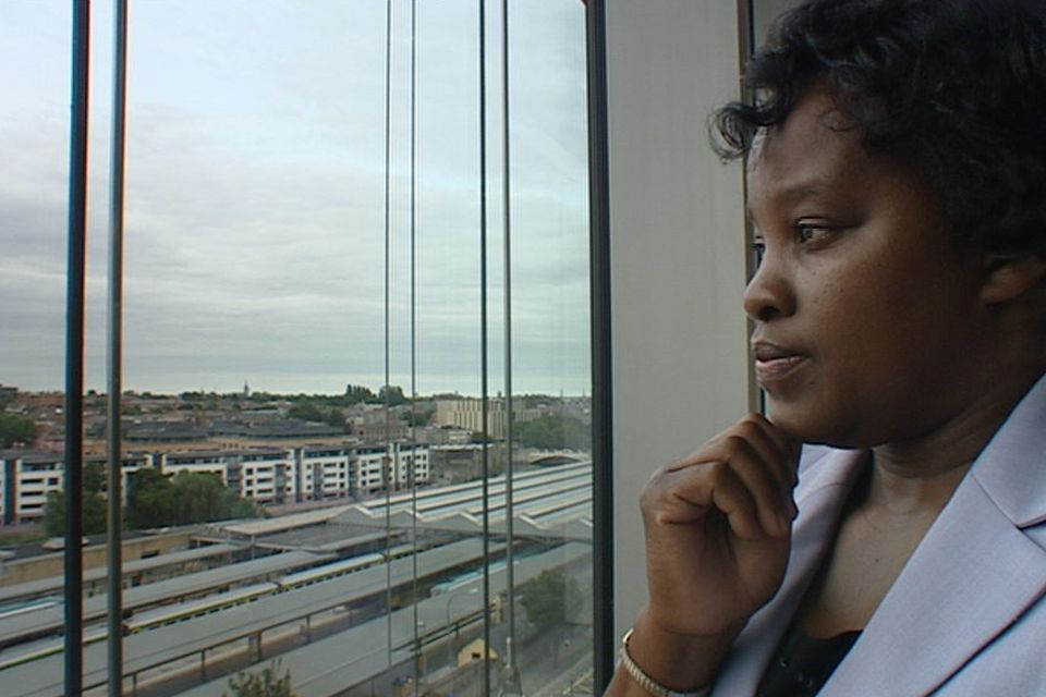 Namucana Nyambe, originally from Zambia, looking out of an office in Dublin