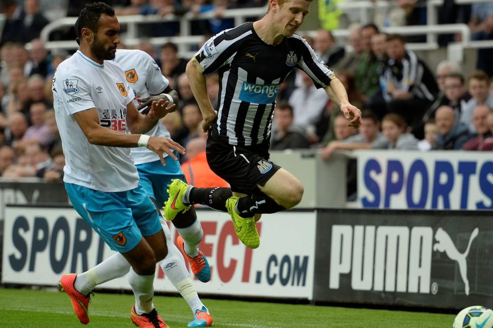 Newcastle's Jack Colback and Hull's Ahmed Elmohamady tussle for the ball. Photo credit: Owen Humphreys/PA Wire