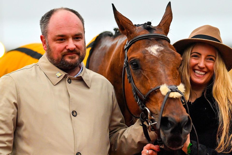 Trainer John McConnell and Amy Crook after sending out Seddon to win the Magners Plate Handicap Chase during day three of the Cheltenham Racing Festival