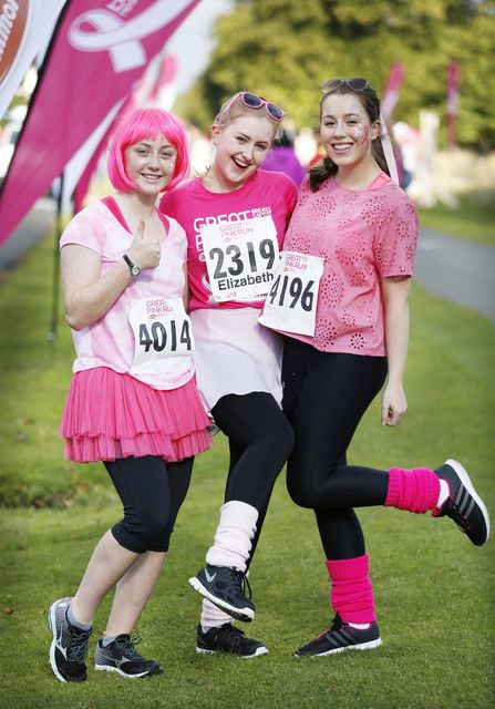 Pictured are (LtoR) Saoirse Allen, Elizabeth Ring and Emily Carney with other thousands of men, women and children taking part in the 5th Great Pink Run.  Photography: Sasko Lazarov/ Photocall Ireland