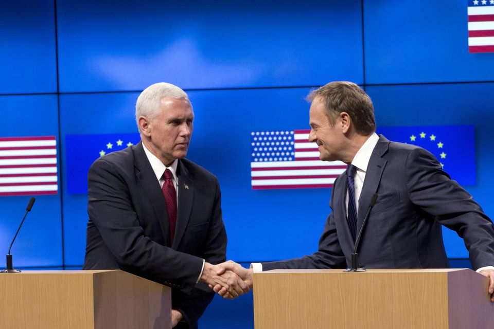 US Vice President Mike Pence shakes hands with European Council president Donald Tusk in Brussels (Virginia Mayo/AP)