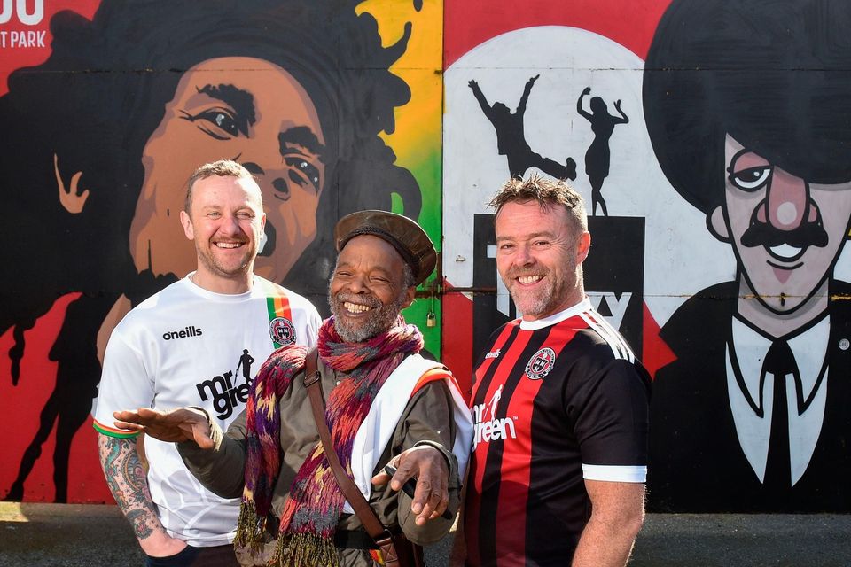 Comedians and fellow Bohs fans PJ Gallagher and Eric Lalor with musician Natty Wailer at Dalymount Park in 2019