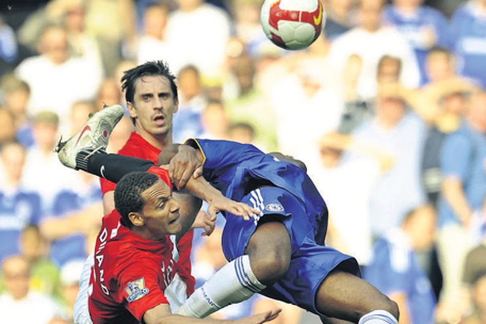 Arsenal's Nicolas Anelka evades a tackle from West Ham United's