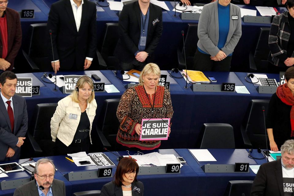 Members of the European Parliament observe a moment of silence at the European Parliament in Strasbourg, January 12, 2015, iREUTERS/Vincent Kessler