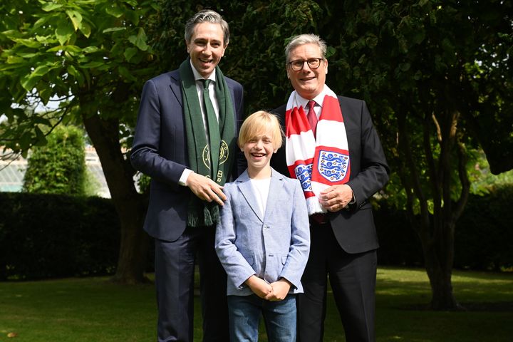 Dublin boy (9) treated for rare illness in UK presents Taoiseach and Keir Starmer with football shirts