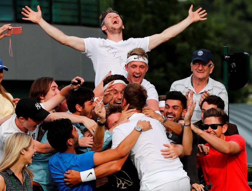 Great Britain's Marcus Willis celebrates with friends  after winning his match against Lithuania's Ricardas Berankis. Picture: REUTERS/Stefan Wermuth