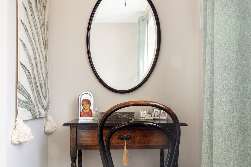Melissa’s bedroom includes an antique table from Treasure Trove in Wexford, while the mirror and chair are from her parents’ home. “My dad restored the chair and I used to sit on it doing my homework.” Photo: Tony Gavin