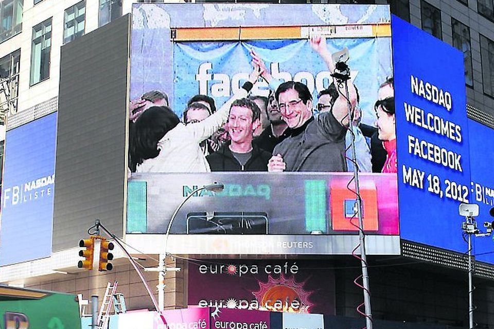 Facebook Debuts As Public Company With Initial Public Offering On NASDAQ Exchange...NEW YORK, NY - MAY 18: Facebook founder Mark Zuckerberg is seen on a screen in Times Square moments after he rang the Opening Bell for the Nasdaq stock market board on May 18, 2012 in New York, United States. The social network site is set to begin trading at roughly 11:00 a.m. ET and on Thursday priced 421 million shares at $38 each. Facebook, a Menlo Park, California based company, will have a valuation exceeding $100 billion.  (Photo by Spencer Platt/Getty Images)...I