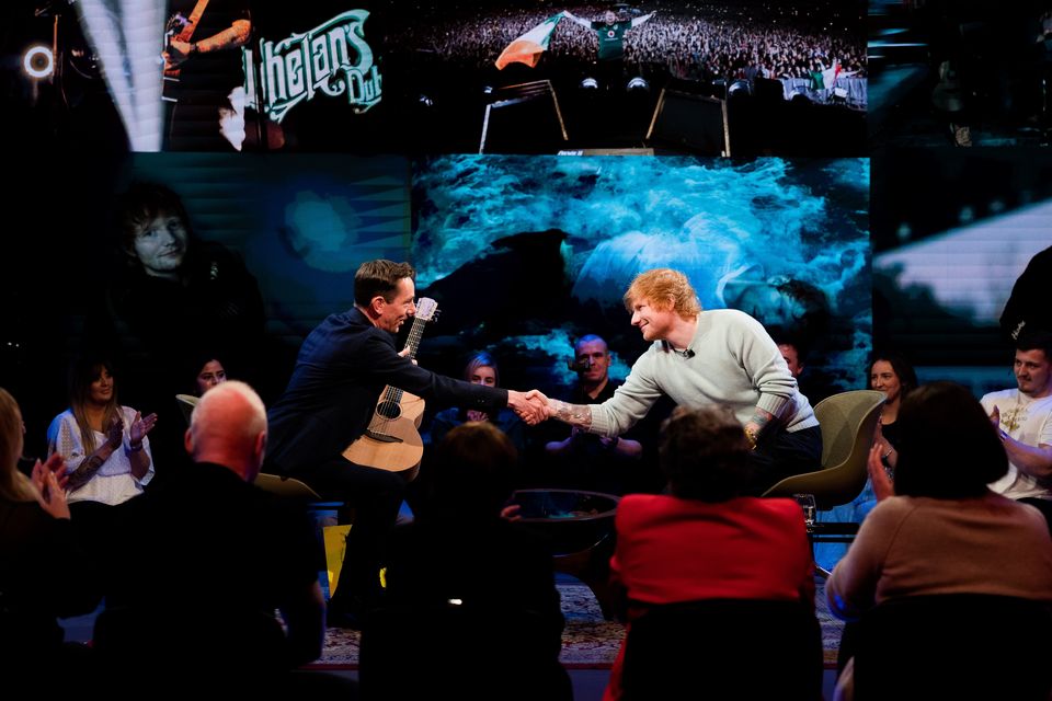 Ed Sheeran gifts a guitar to Ryan Tubridy. Photo: RTÉ's Late Late Show.