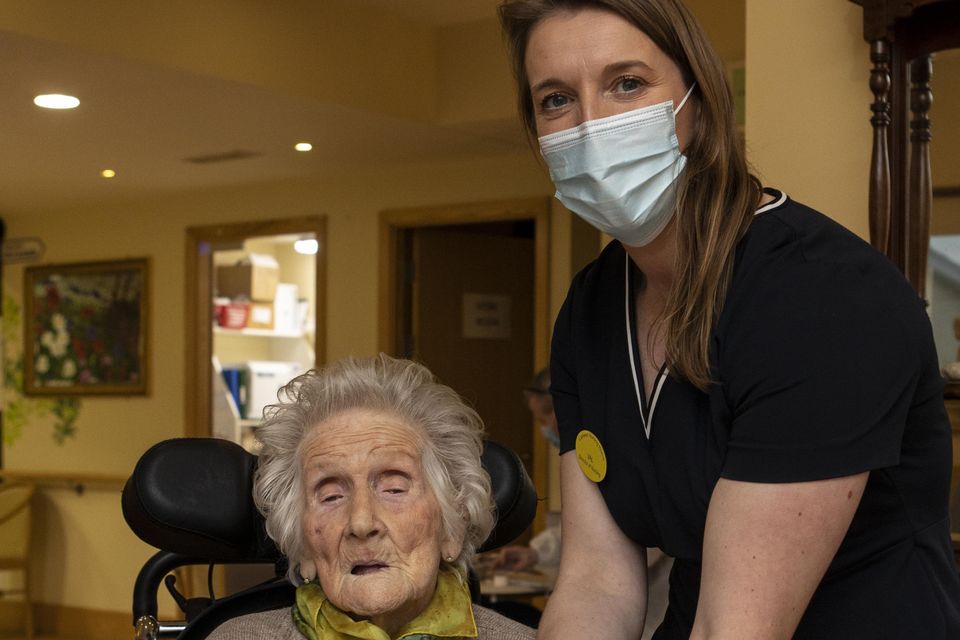 Resident May McLaughlin (102) from Crumlin, with Valerie
Joy, director of nursing, after receiving her Covid jab in
Lisheen nursing home in Rathcoole, Dublin earlier this month