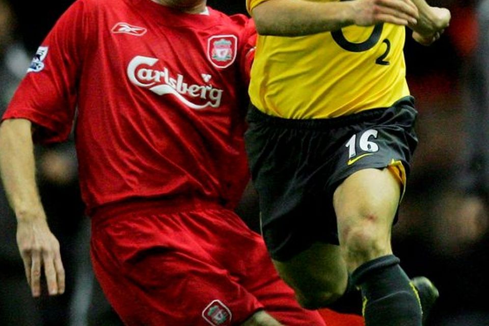 Arsenal's Mathieu Flamini skips past the tackle from Steven Gerrard of Liverpool during the Barclays Premiership match between Liverpool and Arsenal at Anfield on February 14, 2006