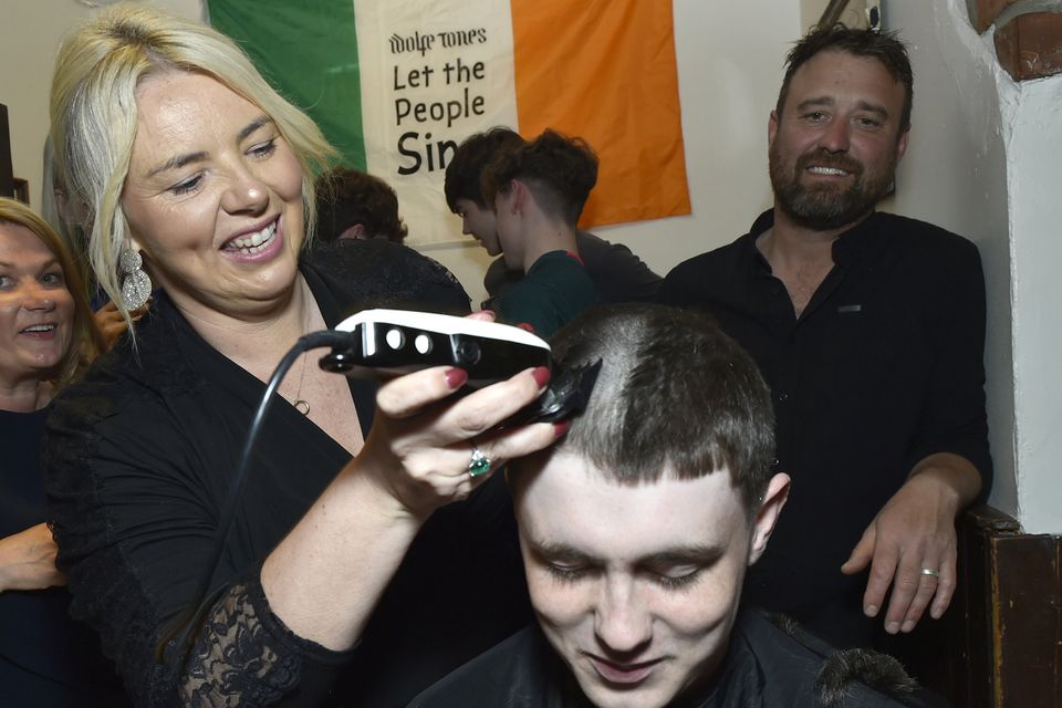 Killian Moran having his head shaved by Tina from Tina's Hair Salon, Ballycanew during the fundraiser in Jimmyz of Courtown on Friday evening in support of Carol Moran's hopsital treatment. Pic: Jim Campbell
