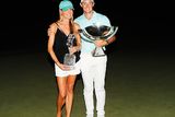 thumbnail: Rory McIlroy of Northern Ireland poses alongside his girlfriend Erica Stoll and the FedExCup and TOUR Championship trophies after his victory over Ryan Moore with a birdie on the fourth extra hole during the TOUR Championship at East Lake Golf Club on September 25, 2016 in Atlanta, Georgia. (Photo by Kevin C. Cox/Getty Images)