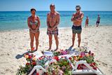 thumbnail: Holidaymakers view flowers left on Marhaba beach where 38 people were killed in a terrorist attack in June 2015 in Sousse, Tunisia