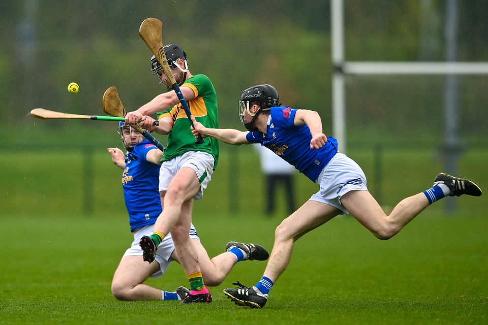 Seán O'Riordáin of Leitrim in action against Jack Barry, right, and Rory Farrell of Cavan during the Allianz Hurling League Division 3B final last April. Photo: David Fitzgerald/Sportsfile