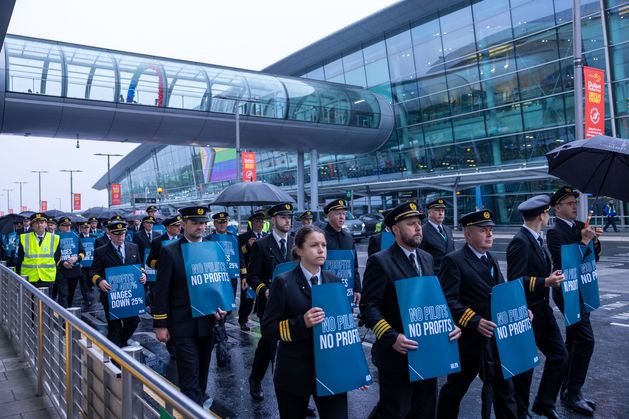 Aer Lingus pilots march around Dublin Airport at the start of the 8-hour strike