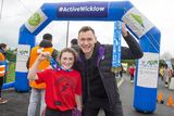 thumbnail: Matilda Ayton from Donard NS with Olympian David Gillick at the Marathon Kids Run in Ballymore Eustace GAA. Photo: Michael Kelly