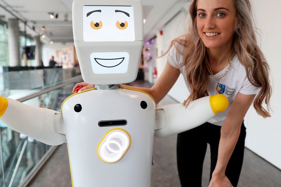 IrelandÕs first socially assistive AI robot 'Stevie II' from robotics engineers at Trinity College Dublin, with Niamh Donnelly, a researcher with the Robotics and Innovation lab, during a special demonstration at the Science Gallery in Dublin.
Brian Lawless/PA Wire