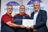 thumbnail: Nathan Clements and Mark Dempsey of Shilleagh-Coolboy GAA Cub being presented with their gold award by Leinster Council Health and Wellbeing Chairperson Dave Murray at the Killeshin Hotel in Portlaoise, Laois.