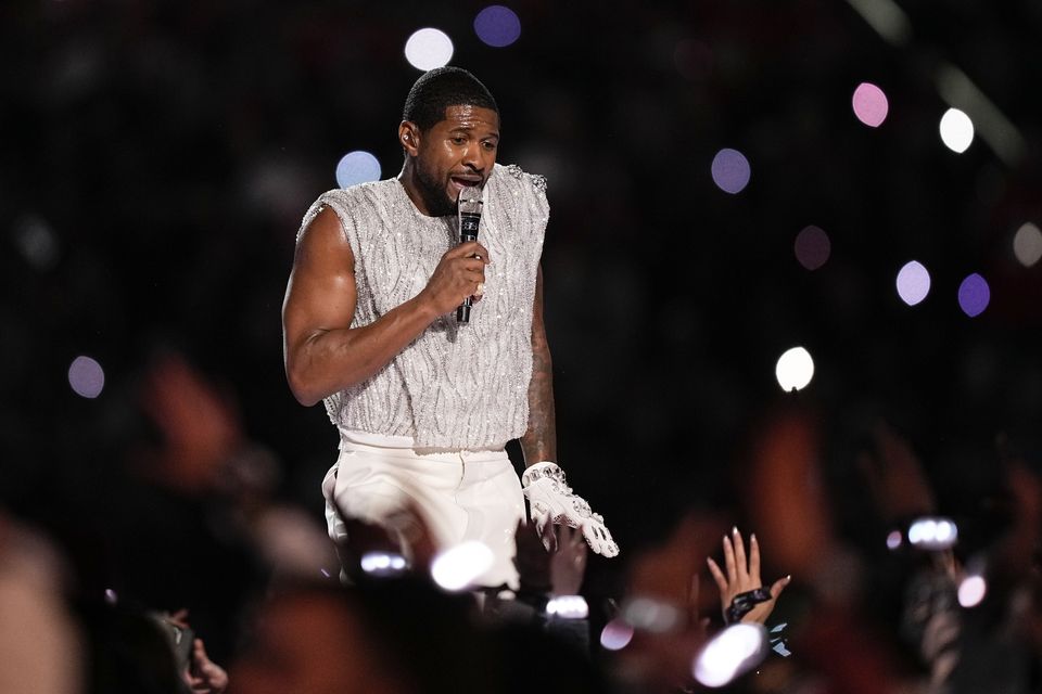 Usher performs during half-time of the Super Bowl (Brynn Anderson/AP/PA)