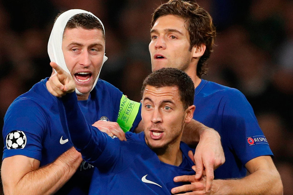 Chelsea's Eden Hazard celebrates scoring his side's third goal with Gary Cahill and Marcos Alonso. Photo: John Sibley/Reuters