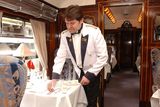 thumbnail: A steward sets a table on the Orient Express. Bloomberg photo by Andy Shaw