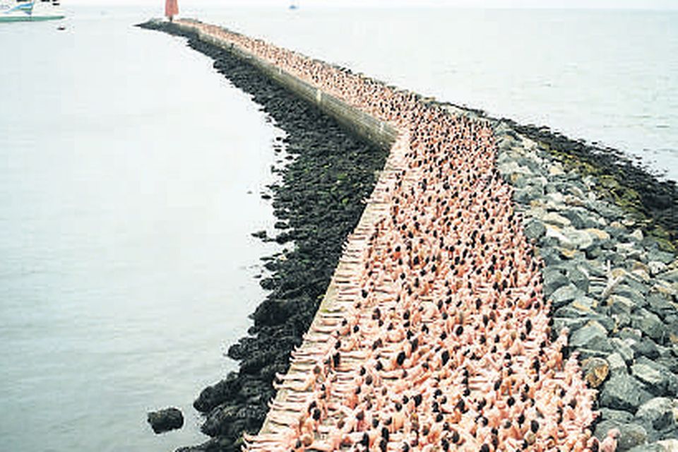 Thousands of volunteers taking part in Spencer Tunick's nude photo shoot at Poolbeg in Dublin
