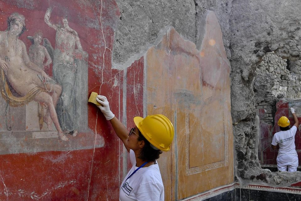 Archaeologist at the Pompeii archaeological site (Ciro Fusco/ANSA via AP)