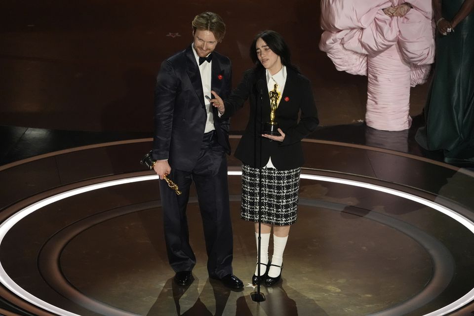 Finneas O’Connell and Billie Eilish accept the award for best original song for What Was I Made For? from Barbie (Chris Pizzello/AP)