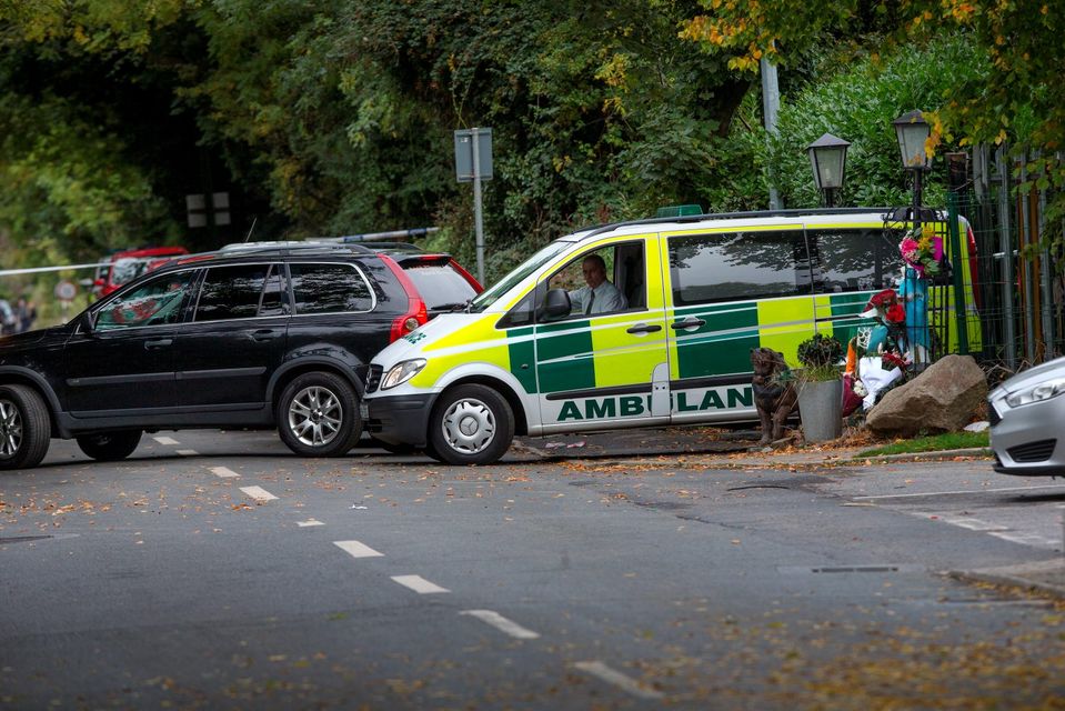 An ambulance containing the bodies of the victims leaves the scene of the tragic fire at Glenmaluck Road, Carrickmines, yesterday evening. Photo: Tony Gavin. 
Photo: Tony Gavin 10/10/2015