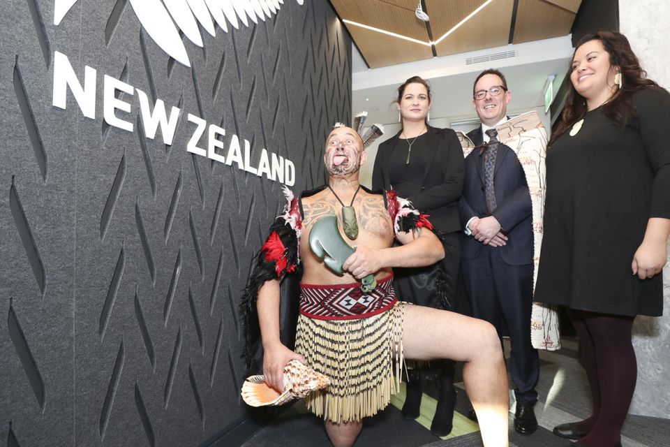 Bruce Simpson performs a traditional ritual with Laura Swift from Palmerston North, New Zealand, living in Drumcondra, Dublin, and Janay Rotorua, from Tauri, New Zealand, living in Cabra, Dublin, and NZ Ambassador Brad Burgess