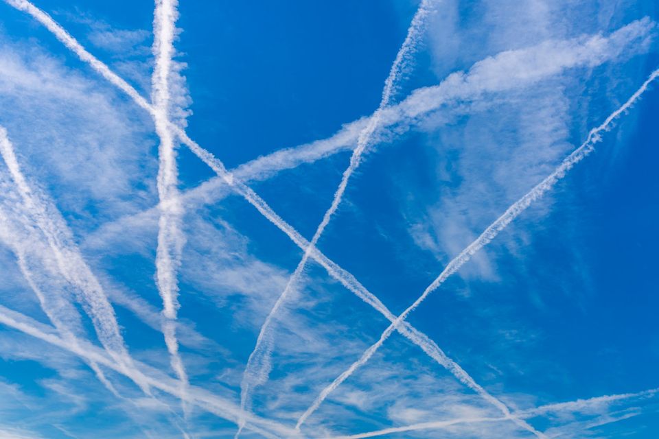 Contrails in a blue sky. Photo: Deposit