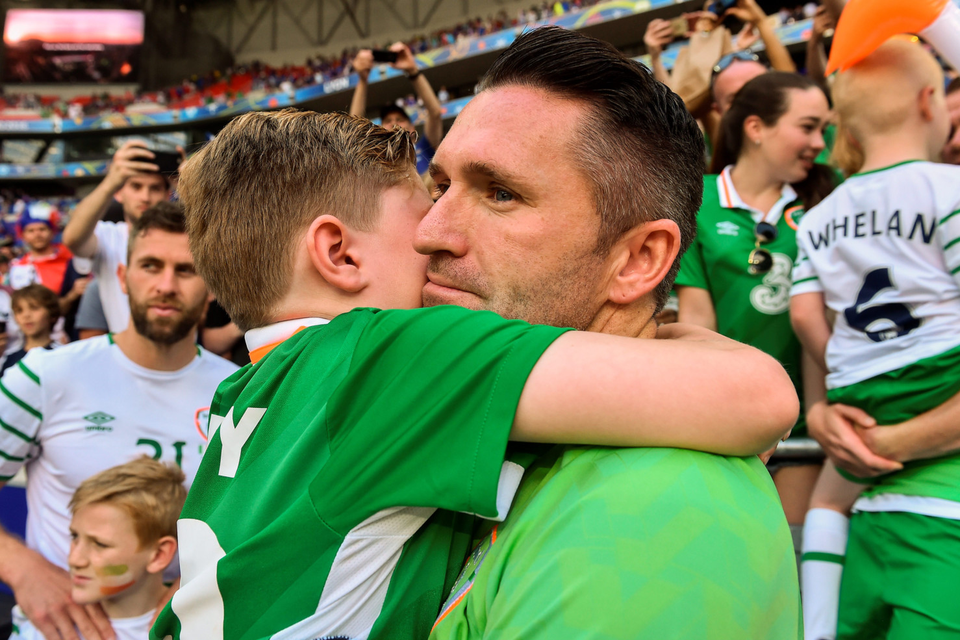 Robbie Keane shares a moment with his son after the match. Photo: David Maher/Sportsfile