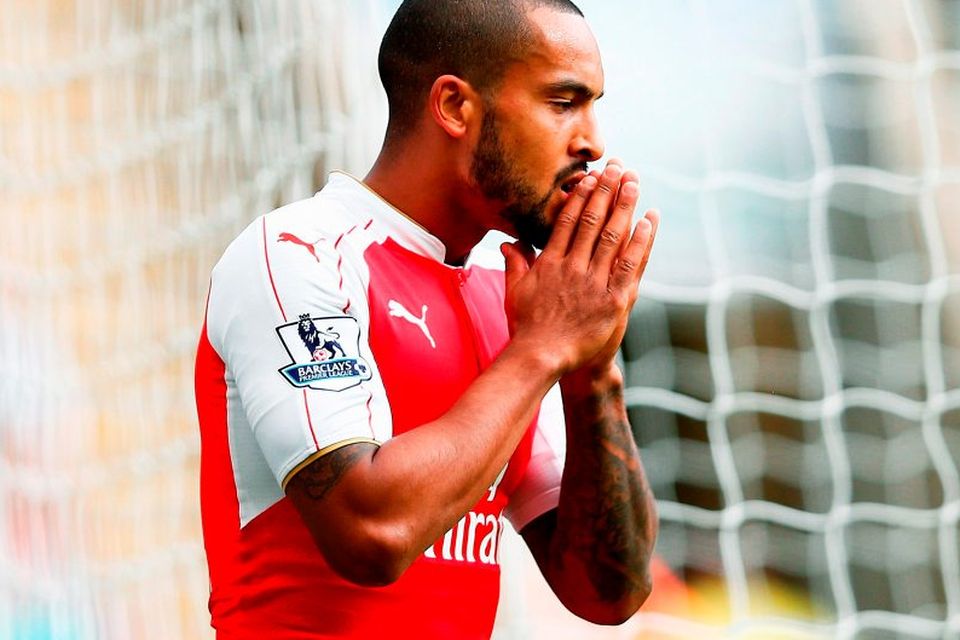 Theo Walcott reacts after missing a chance during Arsenal’s victory against Newcastle