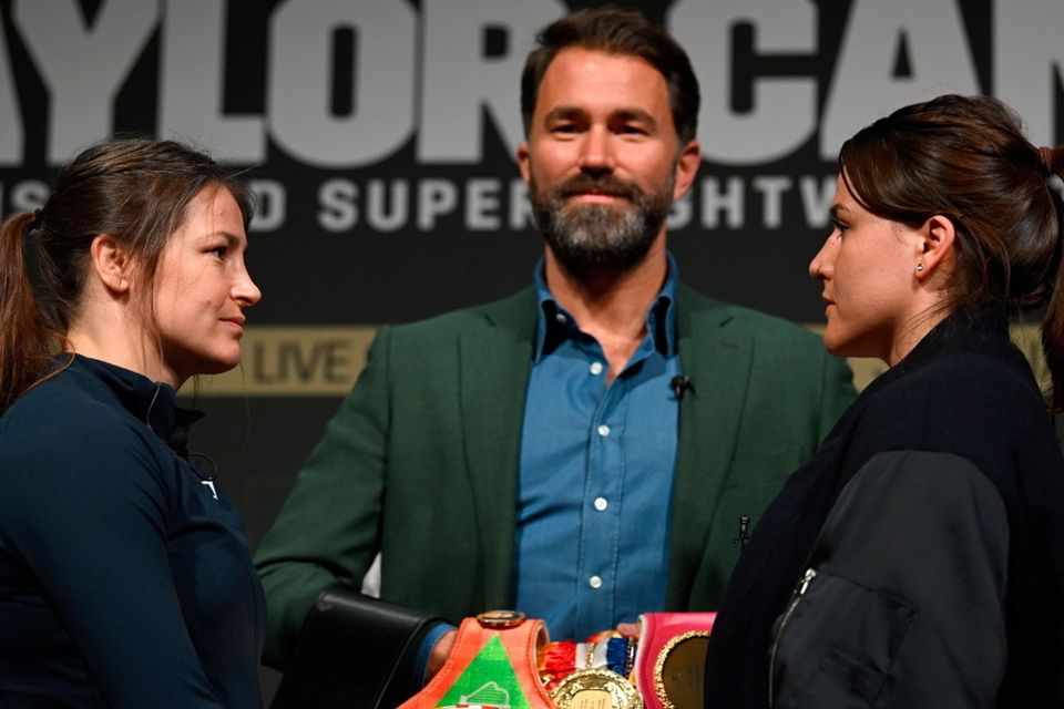 Katie Taylor, left, and Chantelle Cameron face off with promoter Eddie Hearn, centre