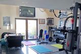 thumbnail: One of the garages is being used as a home gym